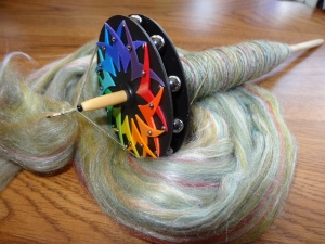 "Fweedom Rings" spindle from Tilt-A-Whorl, with merino-tussah cop.