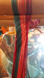 Practice finger weaving project. Please ignore the clutter!